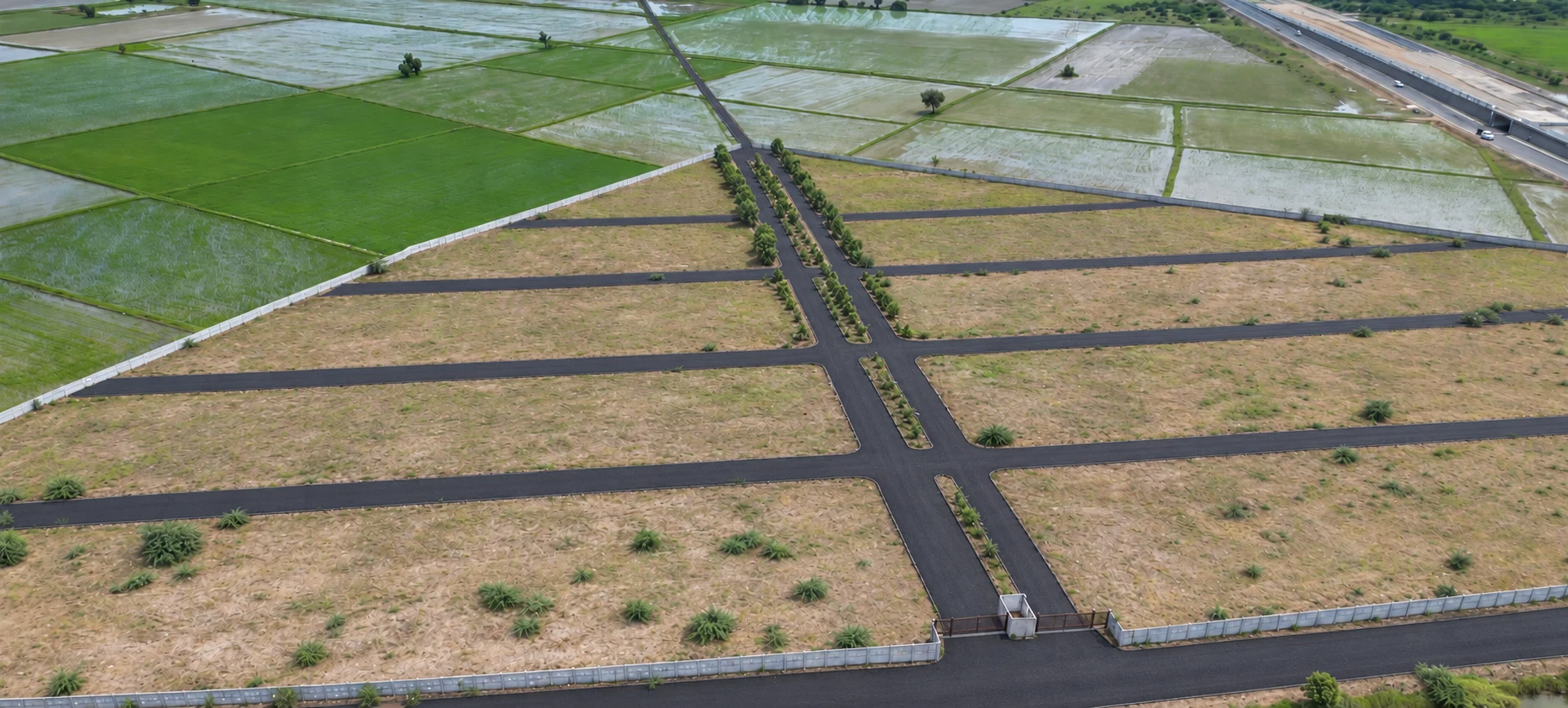 An aerial entrance-side view of Industrial Park 1 with a central road and side roads